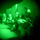 American soldiers of the 1st Battalion, 22nd infantry regiment, 4th Infantry division, are seen ready to raid a suspected Saddam loyalist house in the early hours of Tuesday morning in Tikrit, Iraq, Sept. 9, 2003.